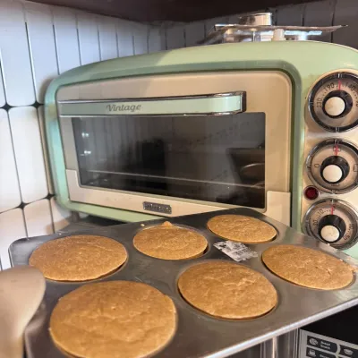 Oat-based Chicken Muffin discs cooling on baking tray